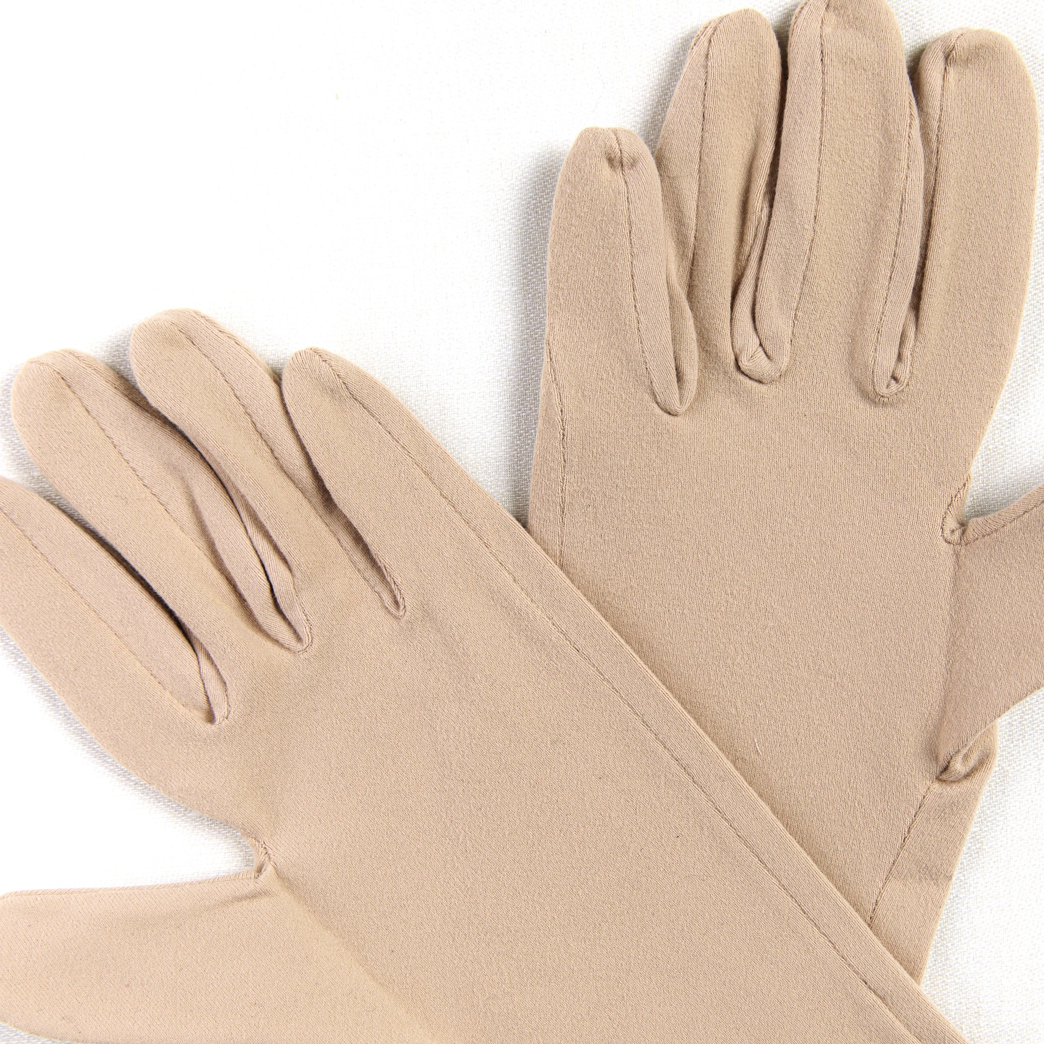 Pair of beige gloves on a white background