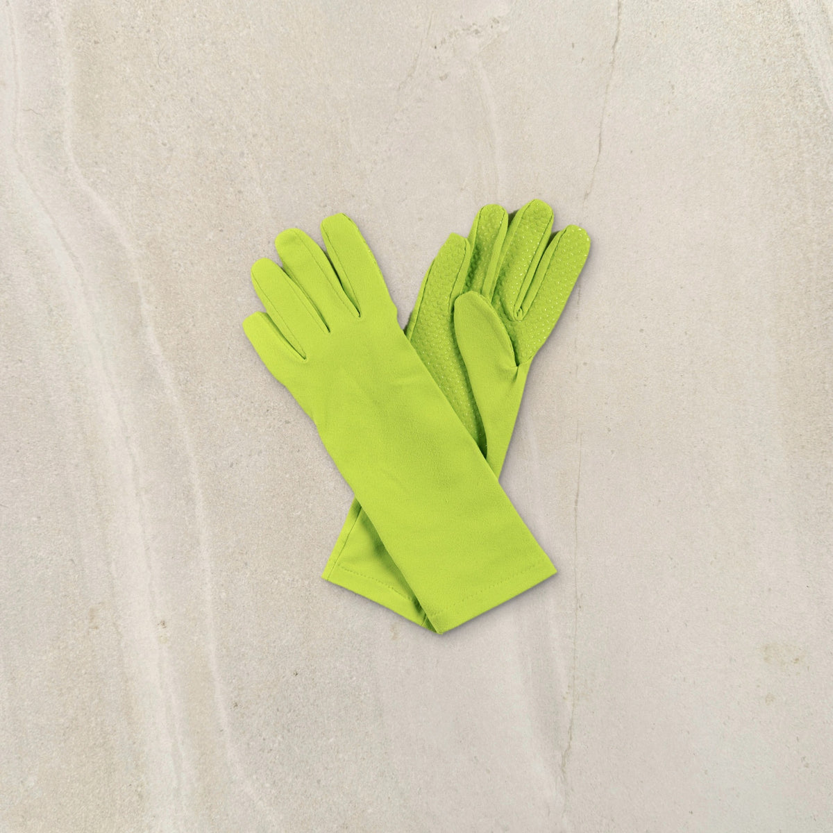 higarden mid rise gardening gloves in grass green, crossed pair showing the grip palm, on limestone