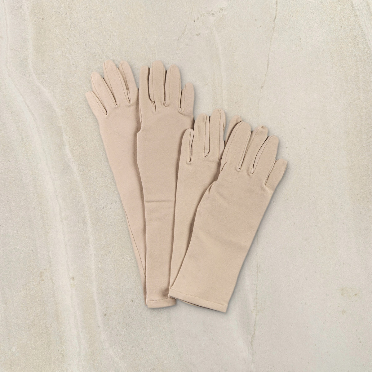 higarden high rise and mid rise gardening gloves in pinenut side by side on limestone