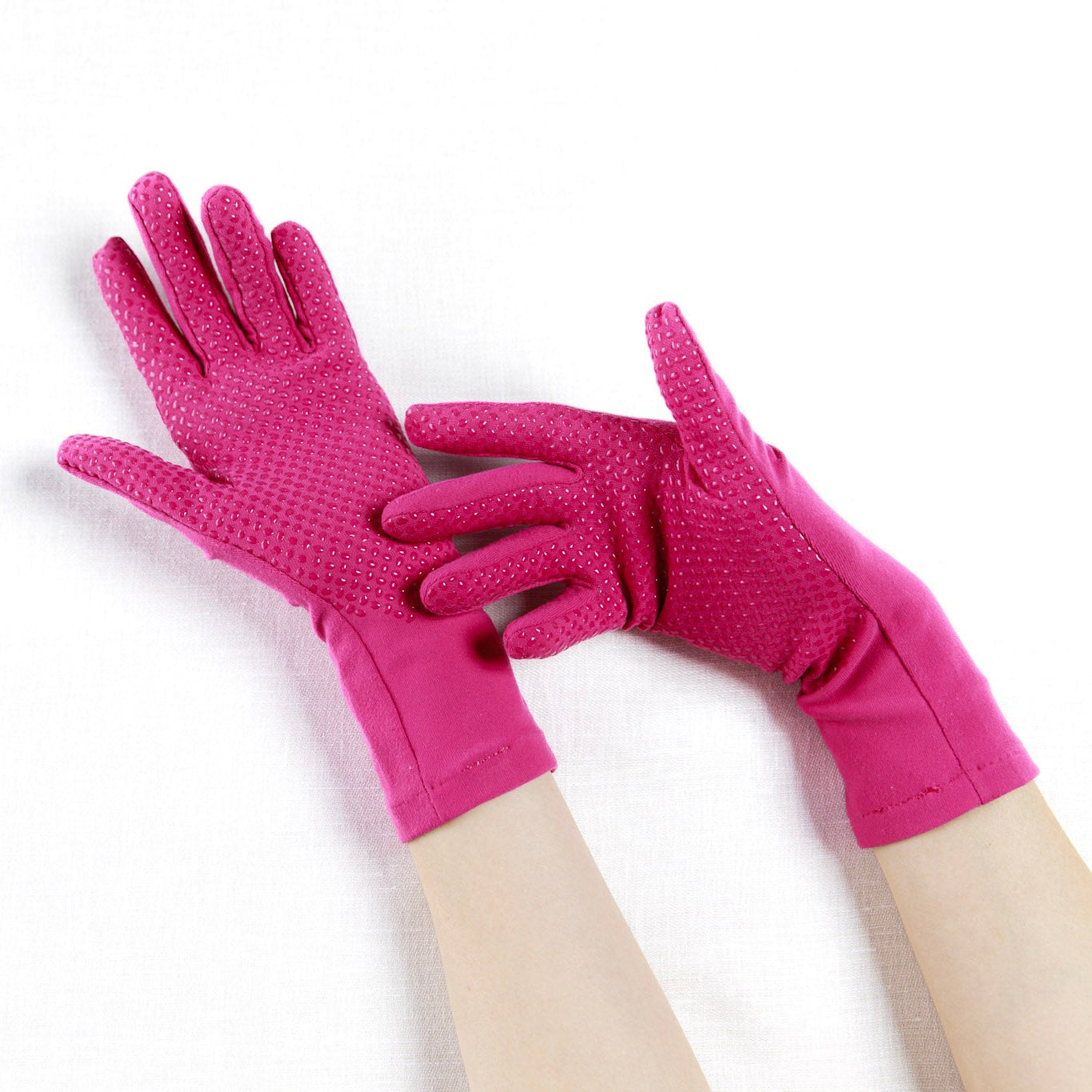 Pair of pink gloves on a white background