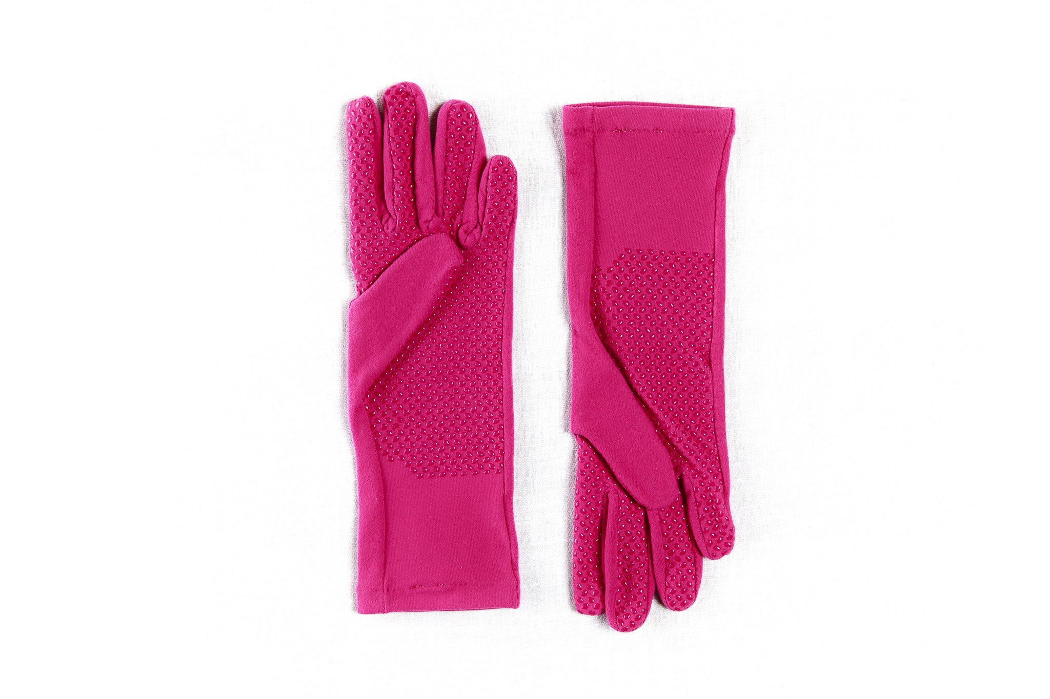 Pair of pink gloves with grip palm, best for women, best for mothers day, on a white background