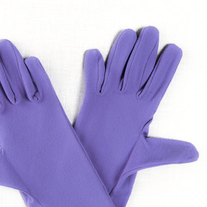 Pair of purple gloves on a white background
