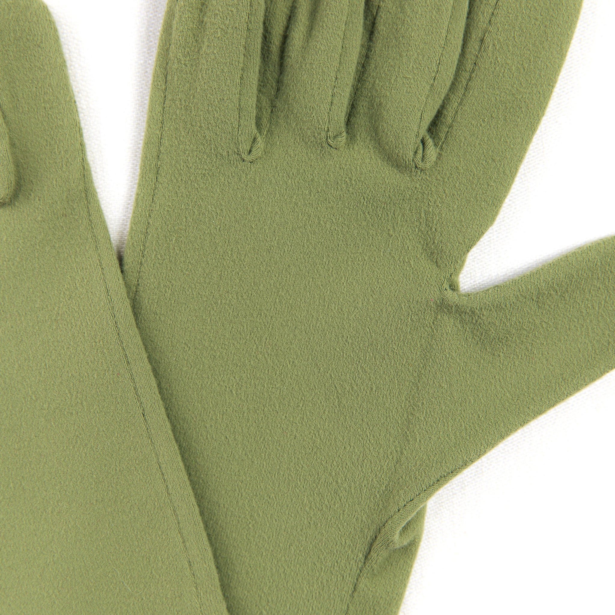 Pair of green gloves on a white background