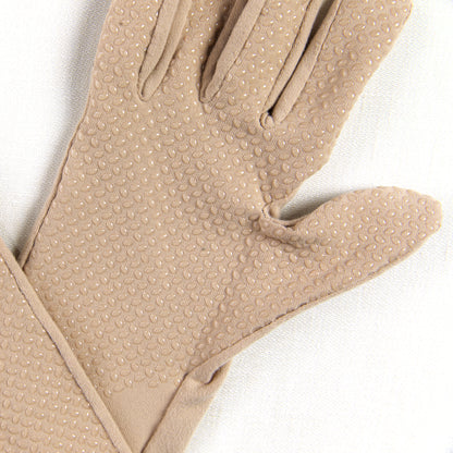 Beige glove with textured palm on a white background