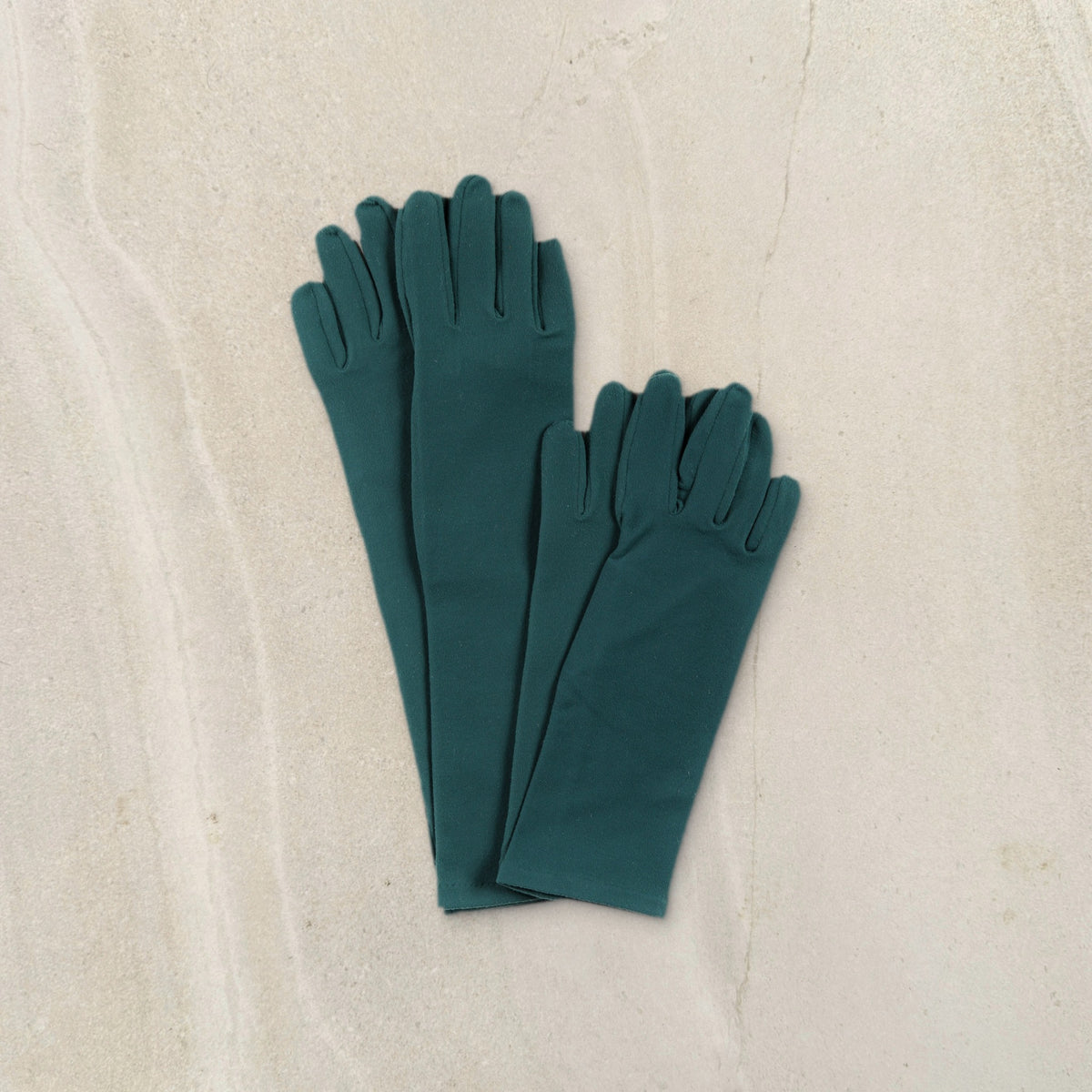 higarden high rise and mid rise gardening gloves in ferngully green side by side on limestone