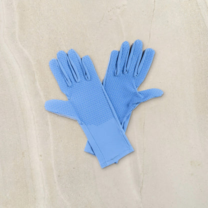 higarden mid rise gardening gloves in dewdrop blue showing the grip palms, flat lay on limestone