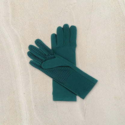 higarden mid rise gardening gloves in ferngully green showing the grip palm, flat lay on limestone