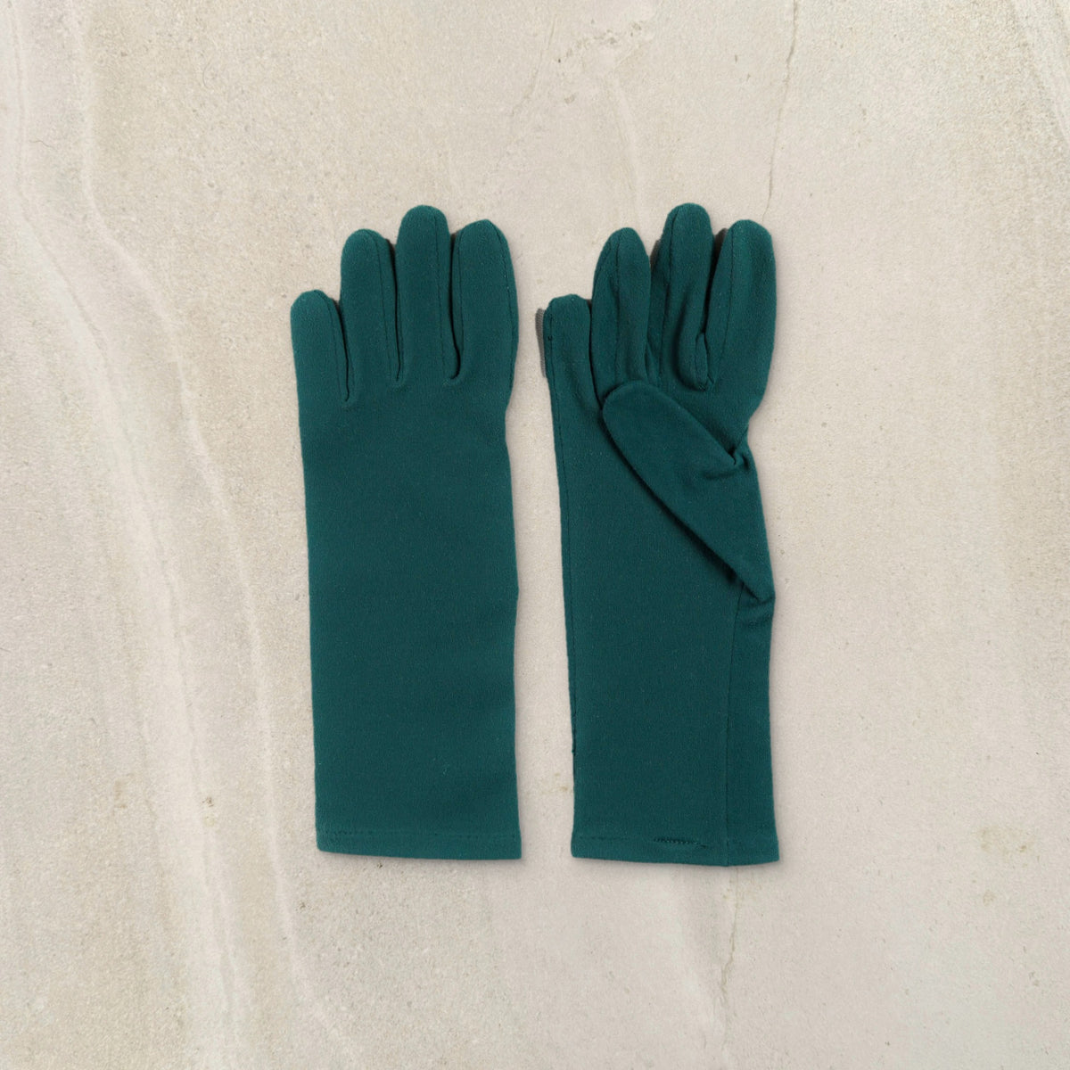 higarden mid rise gardening gloves in ferngully green with smooth palms, flat lay on limestone