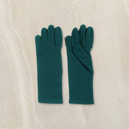 higarden mid rise gardening gloves in ferngully green with smooth palms, flat lay on limestone