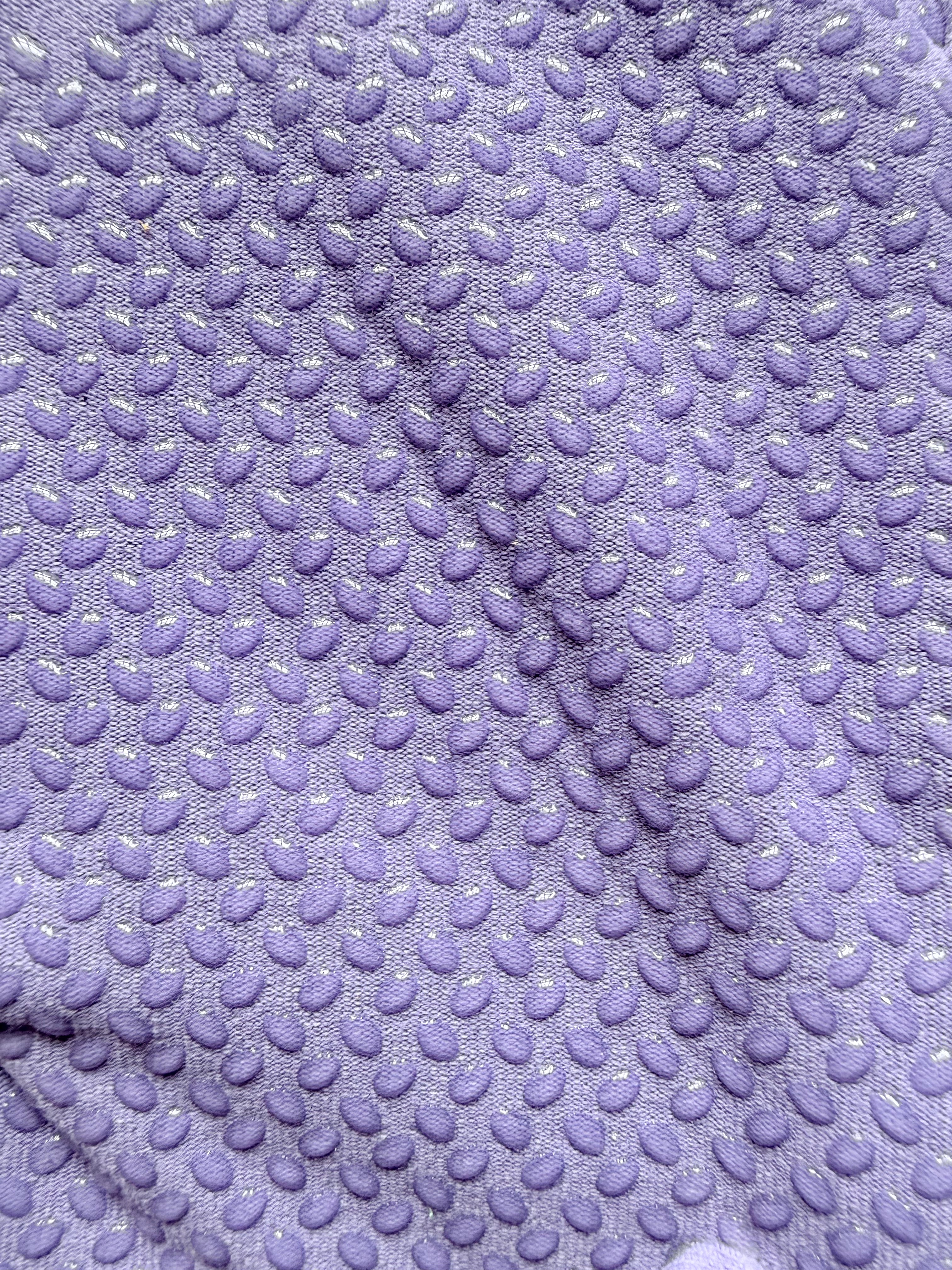 Close-up of textured purple gardening glove grip palm with a pattern